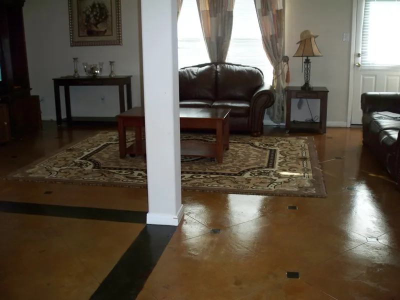 Custom scored concrete design and border on remodeled home