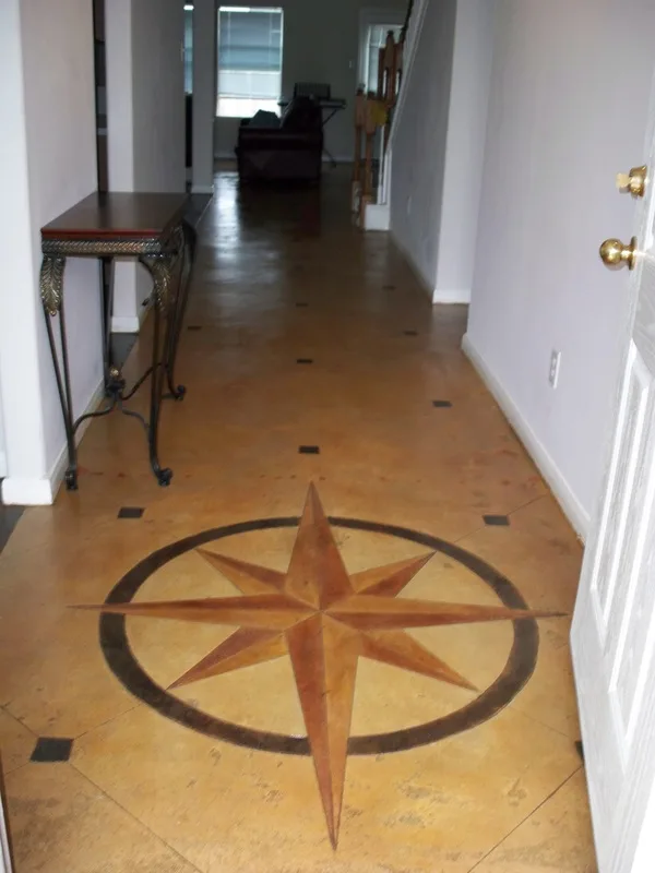 Compass Star and Custom Design scored into stained concrete project