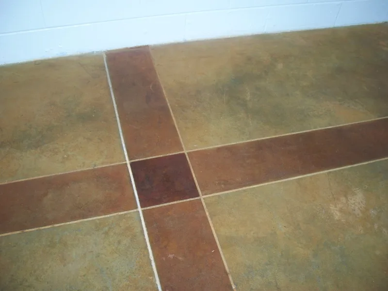 Close up of double line scoring stained concrete design