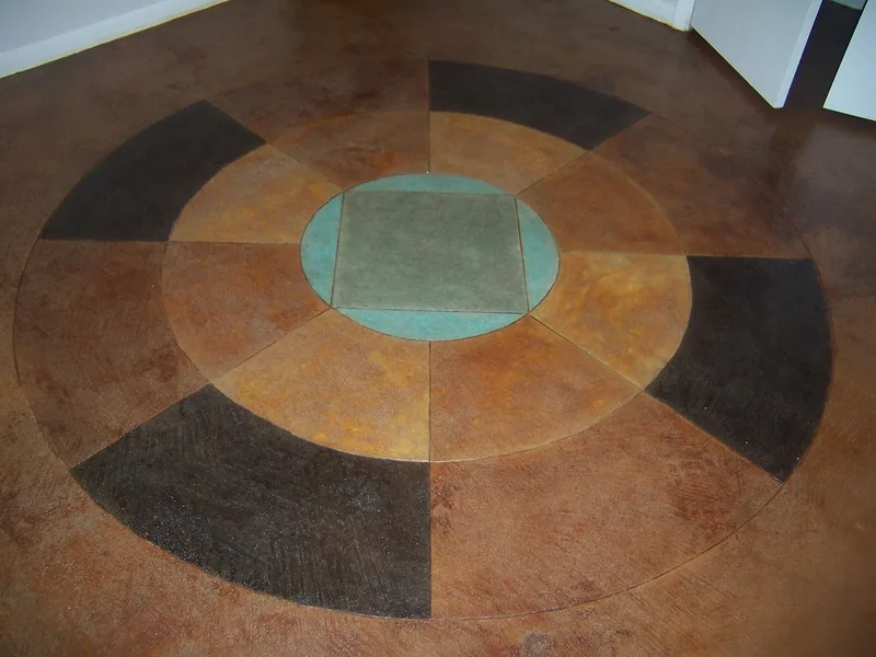 Custom Scored design on concrete floor showing all acid stain colors